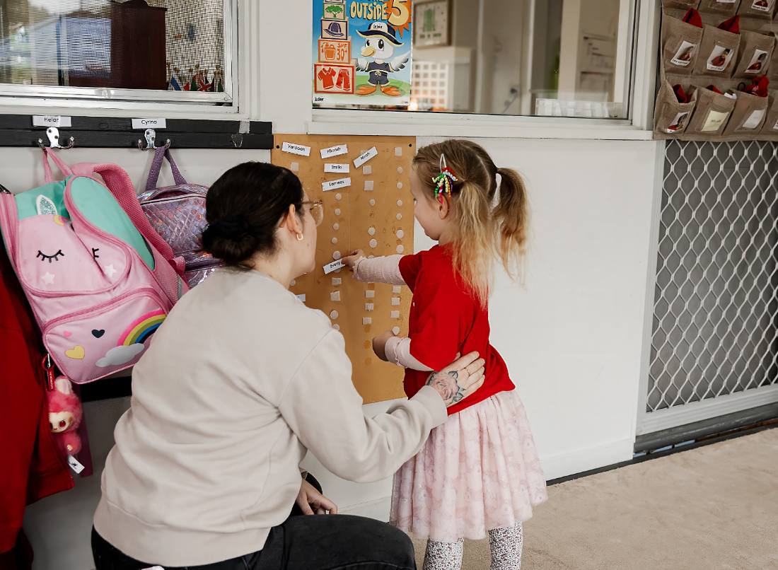 Child concentrating on practical life work